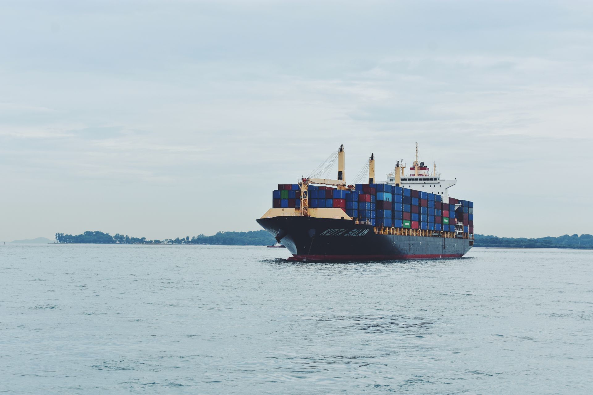 Container ship sailing on open water